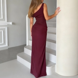 Detail of burgundy one-shoulder maxi dress showing slim fit and elegant matte fabric draping