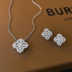 Silver flower jewelry set with sparkling zircon four-leaf clover necklace and earrings