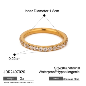 Detail view of gold stainless steel ring with zircon stone and technical dimensions