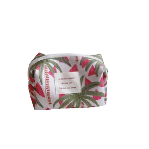 Pink and green palm leaf jacquard pouch for cosmetics and electronics storage