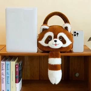 Size comparison of raccoon plush handbag on shelf next to a laptop and smartphone