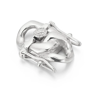 Detailed view of polished stainless steel jewelry clasp with textured silver finish
