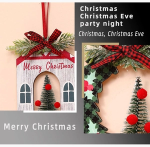 Detail of wooden Christmas cottage ornament with pine needles and red-black checkered bow
