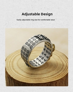 Detailed macro shot of the inner heart sutra engraving on a retro adjustable ring