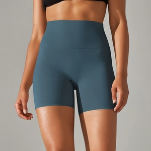 Detail of high-waisted yoga shorts in dark grey blue with wide tummy control waistband