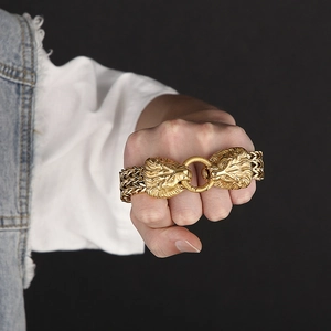 Close-up of men's stainless steel lion head bracelet in polished gold finish