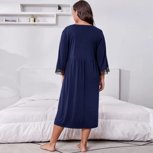 Women's navy blue long sleeve nightgown with lace cuffs and pleated waist detailing