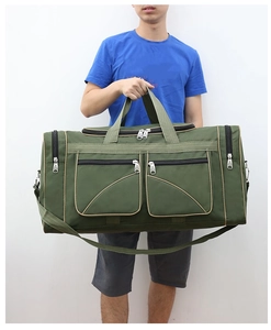 Army green large travel duffel bag with multiple zipper pockets and adjustable shoulder strap