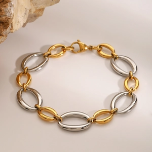 Polished two-tone gold and silver stainless steel chain bracelet with lobster clasp