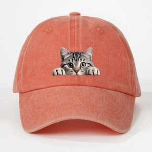 Detailed view of peach-pink washed cotton baseball cap featuring realistic grey tabby cat print