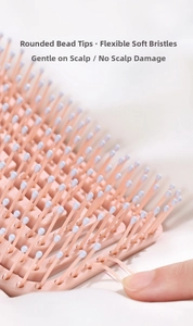 Macro shot of flexible hairbrush bristles with rounded blue tips for scalp massage comfort