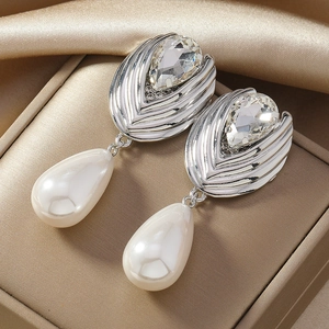 Elegant silver earrings with large crystal and waterdrop pearl in a jewelry box