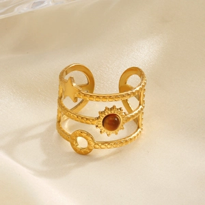 Gold layered ring with sun, moon, star motifs and brown natural stone on silk