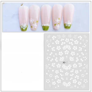 Detail view of white flower nail art stickers JO-1863 with pearl and gradient design