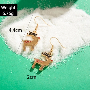 Detail showing red reindeer earring dimensions 4.4cm by 2cm on a snowy background