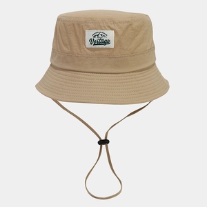 Close-up of khaki quick-dry bucket hat with Vertage mountain patch and windproof cord