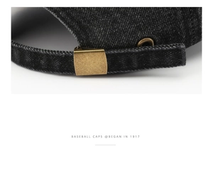 Detail of washed denim baseball cap with vintage bronze adjustable metal buckle closure