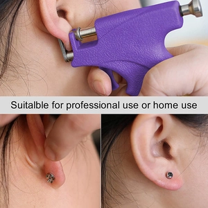 Purple manual ear piercing gun kit with stainless steel studs and usage demonstration