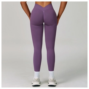 Macro detail of high-waist purple yoga leggings with a V-shaped back cross waistband