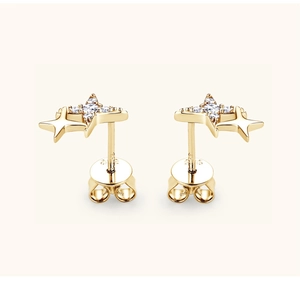 Macro view of gold star stud earrings in S925 sterling silver with white zircon pavé