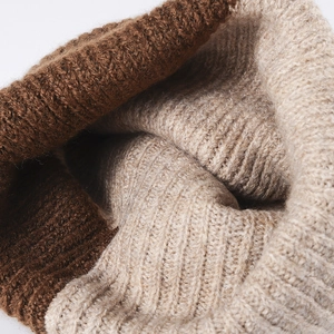 Warm winter rib-knit beanie hat featuring a stylish brown and beige color-block design