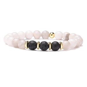Detail of 10mm elastic bracelet with lava stone, translucent beads and gold metal accents