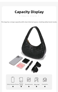 Internal storage capacity of woven leather shoulder bag showing daily essentials
