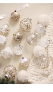 Detailed view of champagne and white Christmas balls with gold textures and beads