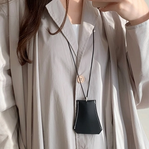 Minimalist black faux leather trapezoid key pouch necklace with white contrast stitching