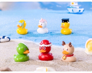 Set of six creative resin mini ducks in diver, unicorn, and Christmas themed micro-landscapes
