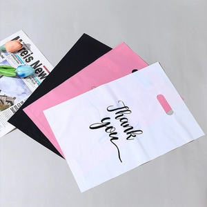 Three premium plastic shopping bags in white, pink, and black colors with die-cut handles
