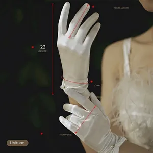 Elegant white satin bridal wedding gloves with pearl accents and silky vintage finish