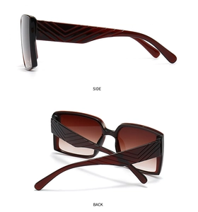 Detail view of large square coffee gradient sunglasses with V-shaped stripe temples
