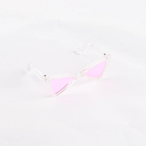 Detail shot of vintage cat-eye pet sunglasses with transparent frames and pink lenses