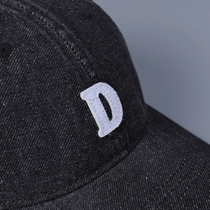 Washed denim baseball cap in black with white embroidered letter D, unisex sun hat