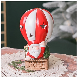 Detail of Santa Claus in hot air balloon with star cutouts for Christmas decoration