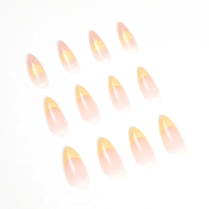 French tip stiletto press-on nails with yellow floral patterns and gradient nude base