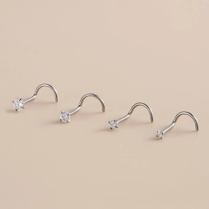 Set of four G23 titanium nose studs with clear cubic zirconia in varying sizes