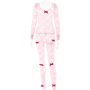 Detail of pink lace bodysuit featuring delicate mesh patterns and red decorative bows