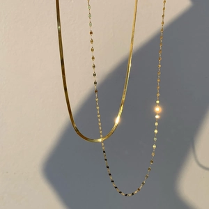 Double-layered gold stainless steel necklaces with herringbone and sequin chain designs