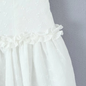 White lace embroidery strap dress featuring ruffled details and slimming A-line silhouette