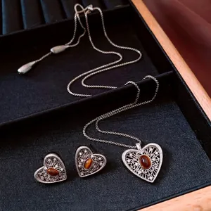 Vintage silver hollow heart jewelry set with reddish-brown gems and zircon necklace