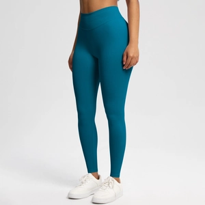 Detailed front view of high-waisted seamless peach lift yoga leggings in dark teal color