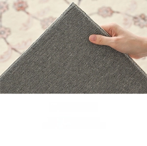 Detail of floral rug showing breathable cotton linen anti-slip backing and thick texture