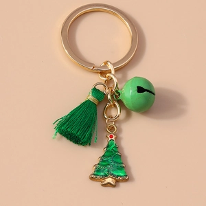 Detail showing Christmas keychain with green bell, tassel, and Christmas tree charm