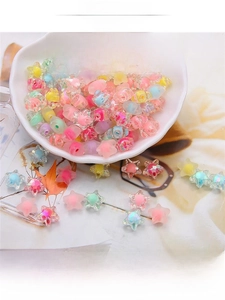 Macro shot of colorful translucent acrylic star beads for DIY handmade jewelry crafts