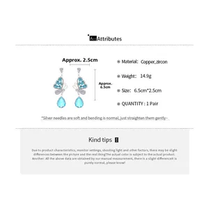 Detail view of silver needle butterfly drop earrings with blue zircons and dimensions