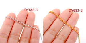 Close-up of gold and silver stainless steel DIY jewelry chains showing fine texture