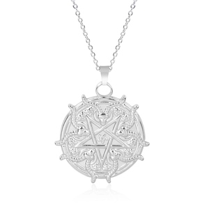 Macro shot of silver stainless steel pendant with pentagram and goat head occult symbols