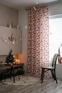Detail of Christmas themed red candy pattern curtain with natural cotton linen texture